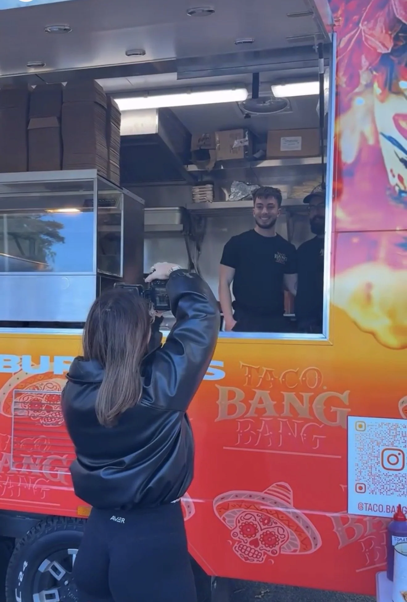Behind the scenes at a True Luxe Media shoot at a taco truck